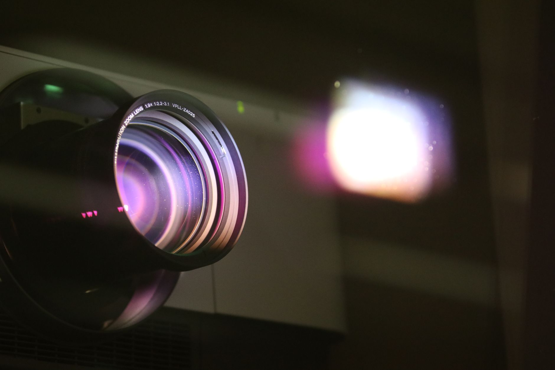 a black camera lens reflecting square light